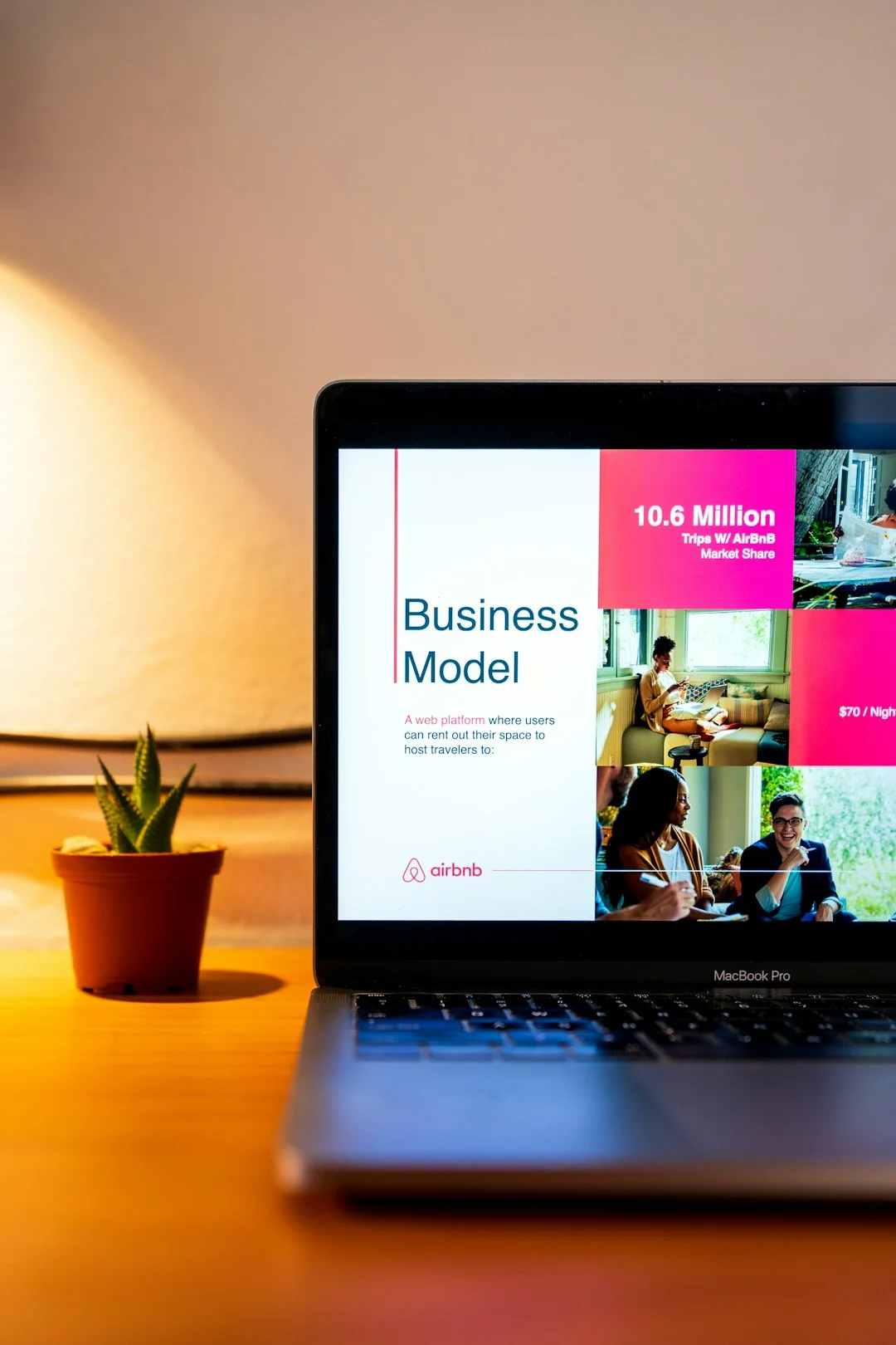 Dual monitors on a desk, showcasing web design in a modern office setting.